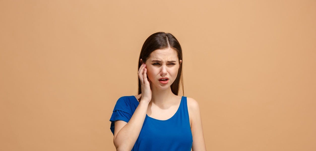 A woman suffering from a earache