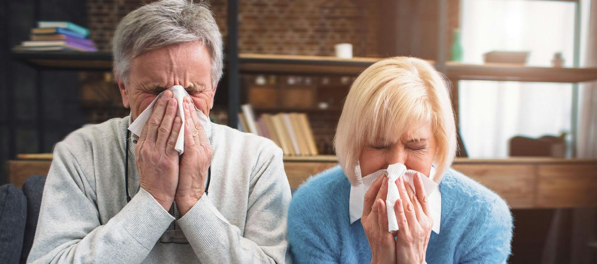 A older couple suffering from a cold